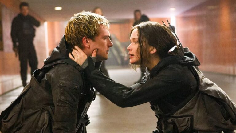 Como Katniss Everdeen e Peeta Mellark retornam em Jogos Vorazes: Amanhecer na Colheita?